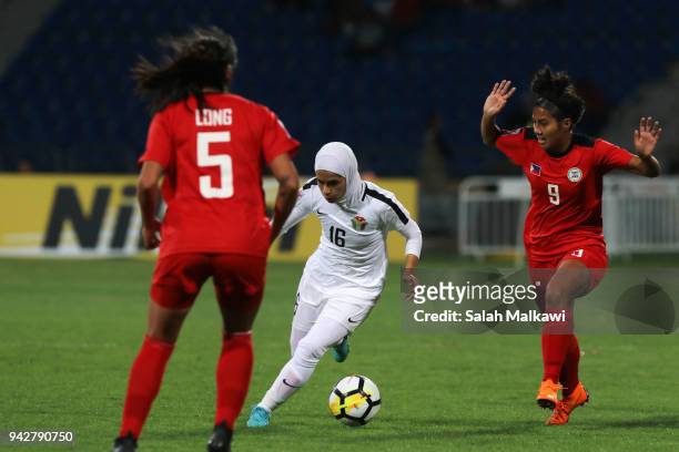 Jesse SHUGG and Hali LONG of Philippines competes with Shahnaz JEBREEN of Jordan during their match for the AFC Womenâs Asian Cup Jordan 2018, in...