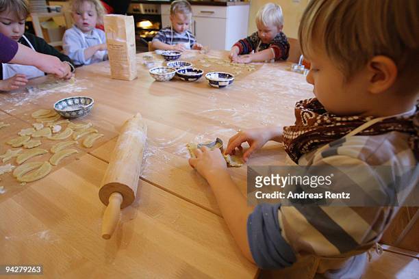 Children making sugar cookies at a kindergarten of the Rudolf Steiner Waldorfschule on December 11, 2009 in Berlin, Germany. Each year Berlin's...