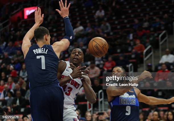 Anthony Tolliver of the Detroit Pistons drives the ball to the basket as Dwight Powell and Aaron Harrison of the Dallas Mavericks slaps the ball away...