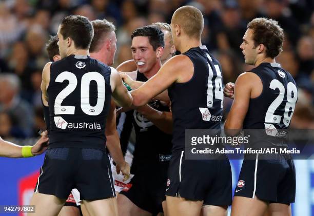 Blues players get around Jacob Weitering of the Blues as Magpies players Ben Crocker and Jaidyn Stephenson get stuck into him for giving away a free...