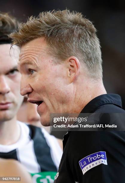 Nathan Buckley, Senior Coach of the Magpies addresses his players during the 2018 AFL round 03 match between the Carlton Blues and the Collingwood...