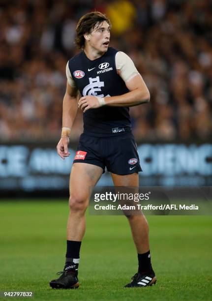 Caleb Marchbank of the Blues is seen playing sore after injuring his ankle during the 2018 AFL round 03 match between the Carlton Blues and the...