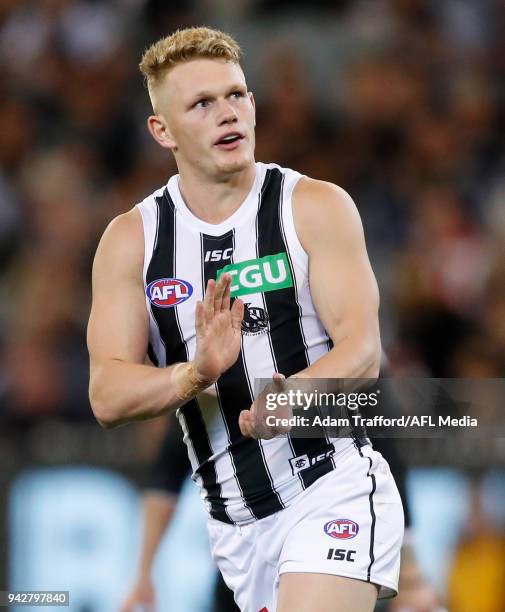 Adam Treloar of the Magpies celebrates a goal during the 2018 AFL round 03 match between the Carlton Blues and the Collingwood Magpies at the...