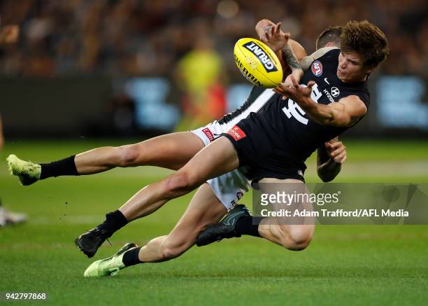Paddy Dow of the Blues is tackled by Jeremy Howe of the Magpies during the 2018 AFL round 03 match between the Carlton Blues and the Collingwood...
