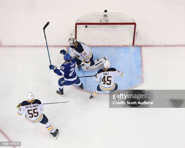Brayden Point of the Tampa Bay Lightning watches the puck fly into the net against goalie Chad Johnson of the Buffalo Sabres during the first period...