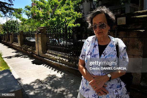 Maria del Rosario de Cerruti poses in front of the Santa Cruz church on November 16, 2009 next to the tombs of some victims. Twelve people, known as...