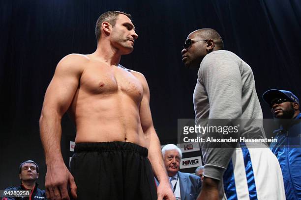 Vitali Klitschko of Ukraine and Kevin Johnson of USA face each other during the weigh in at the Postfinance-Arena on December 11, 2009 in Bern,...