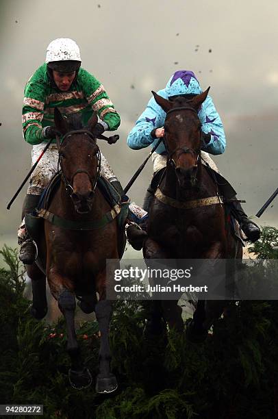 Mr J.T. McNamara and Garde Champetre clear the last fence with the Andrew Glassonbury ridden Double Dizzy before wining The Glenfarclas Cross Country...