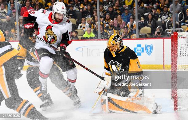 Casey DeSmith of the Pittsburgh Penguins protects the net against Tom Pyatt of the Ottawa Senators at PPG Paints Arena on April 6, 2018 in...