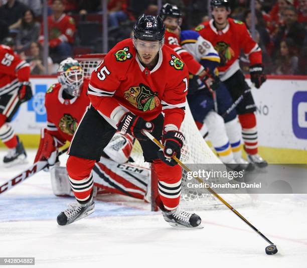Artem Anisimov of the Chicago Blackhawks clears the puck against the St. Louis Blues at the United Center on April 6, 2018 in Chicago, Illinois.