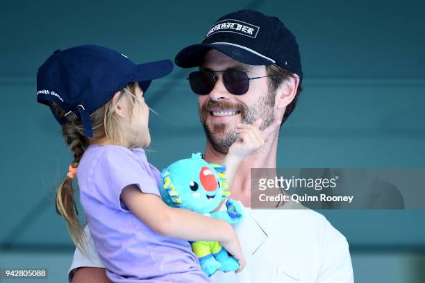 Actor Chris Hemsworth and daughter India Rose Hemsworth attend the swimming on day three of the Gold Coast 2018 Commonwealth Games at Optus Aquatic...