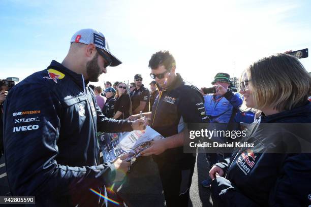 Shane Van Gisbergen driver of the Red Bull Holden Racing Team Holden Commodore ZB signs autographs for fans during the Supercars Tasmania SuperSprint...