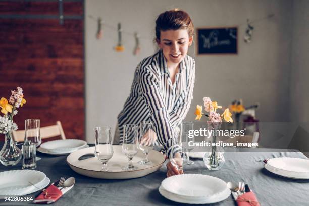 woman serving champagne glasses - setting the table stock pictures, royalty-free photos & images