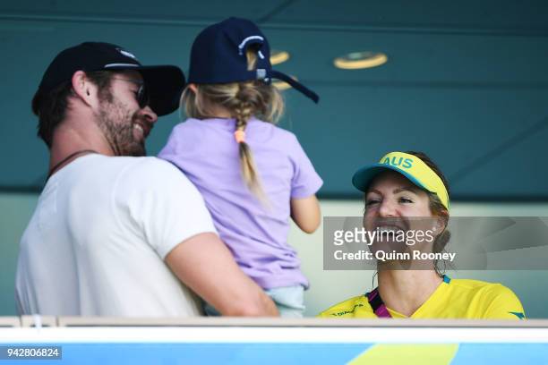 Emily Seebohm of Australia talks to Actor Chris Hemsworth and his daughter India Rose Hemsworth on day three of the Gold Coast 2018 Commonwealth...