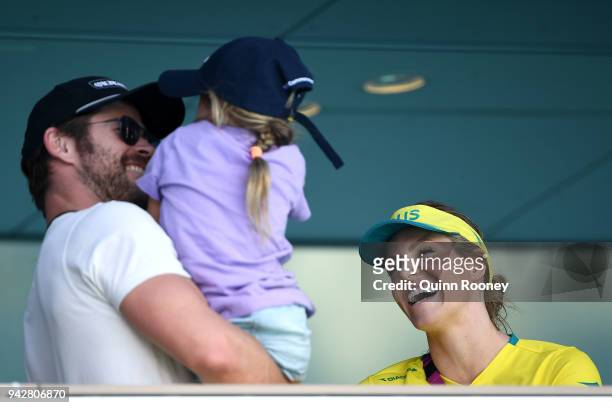 Emily Seebohm of Australia talks to Actor Chris Hemsworth and his daughter India Rose Hemsworth on day three of the Gold Coast 2018 Commonwealth...