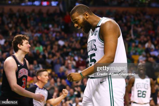 Greg Monroe of the Boston Celtics reacts after being fouled by Omer Asik of the Chicago Bulls during a game at TD Garden on April 6, 2018 in Boston,...