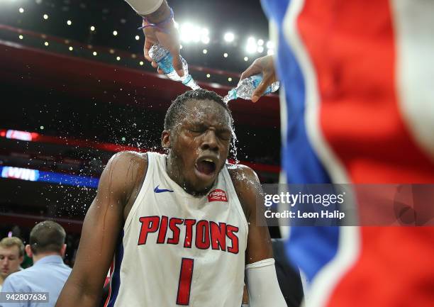 Reggie Jackson of the Detroit Pistons gets doused with water in celebration of defeating the Dallas Mavericks at Little Caesars Arena on April 6,...