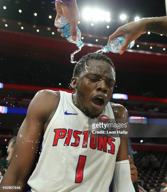 Reggie Jackson of the Detroit Pistons gets doused with water in celebration of defeating the Dallas Mavericks at Little Caesars Arena on April 6,...