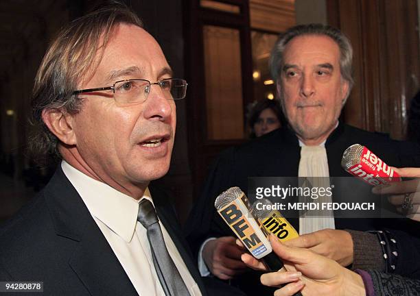 French Bruno Pavlovsky , in charge of fashion department in French fashion giant Chanel, flanked by his lawyer Gerard Delile, answers to journalists...