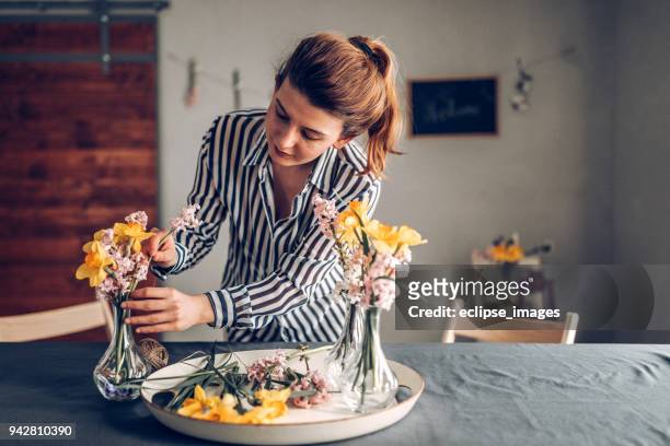 preparing table for dinner - woman arranging stock pictures, royalty-free photos & images