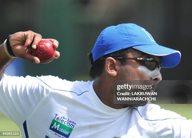 Sri Lankan cricketer Mahela Jayawardene throws a ball during a practice session at The P. Saravanamuttu Stadium in Colombo on July 11 on the eve of...