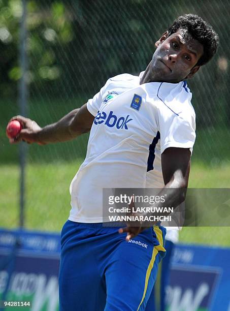 Sri Lankan cricketer Angelo Mathews delivers a ball during a practice session at The P. Saravanamuttu Stadium in Colombo on July 11 on the eve of the...