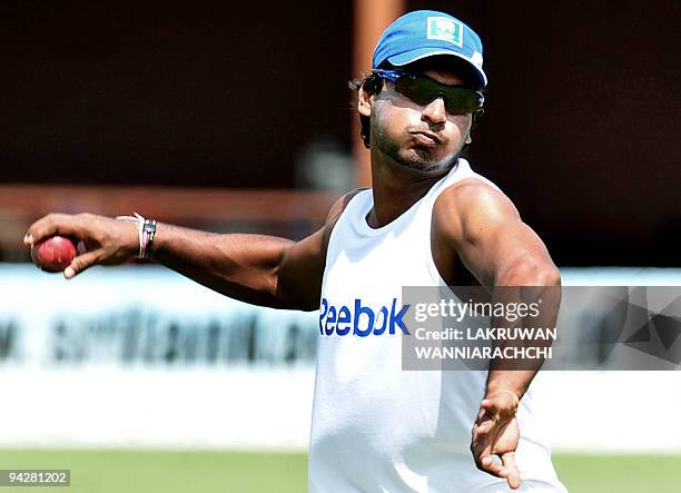 Sri Lankan captain Kumar Sangakkara throws a ball during a practice session at The P. Saravanamuttu Stadium in Colombo on July 11 on the eve of the...