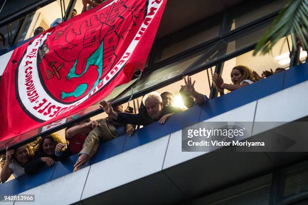 Former President Luiz Inacio Lula da Silva greets his supporters from a window of the Metalworkers' Union on April 6, 2018 in Sao Bernardo do Campo,...