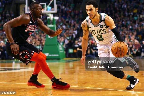 Shane Larkin of the Boston Celtics drives to the basket past Jerian Grant of the Chicago Bulls during a game at TD Garden on April 6, 2018 in Boston,...