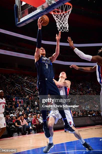 Dwight Powell of the Dallas Mavericks handles the ball against the Detroit Pistons on April 6, 2018 at Little Caesars Arena in Detroit, Michigan....