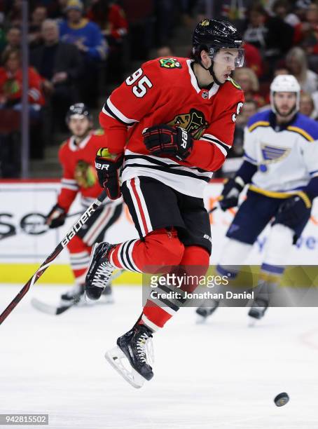 Dylan Sikura of the Chicago Blackhawks leaps out of the way of a teammates shot against the St. Louis Blues at the United Center on April 6, 2018 in...