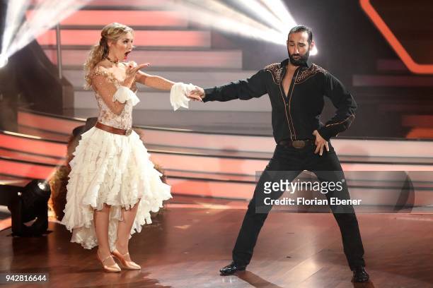 Julia Dietze and Massimo Sinató perform on stage during the 3rd show of the 11th season of the television competition 'Let's Dance' on April 6, 2018...
