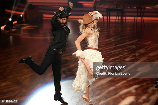 Julia Dietze and Massimo SinatÃ³ perform on stage during the 3rd show of the 11th season of the television competition 'Let's Dance' on April 6, 2018...