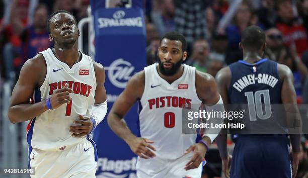 Reggie Jackson and Andre Drummond of the Detroit Pistons looks to the sidelines during the first quarter of the game against the Dallas Mavericks at...