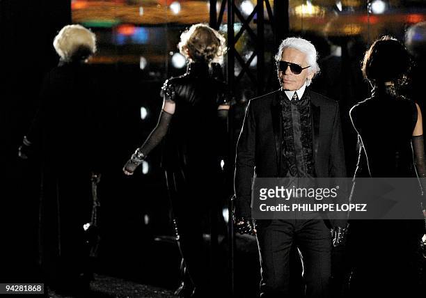 German-born fashion designer Karl Lagerfeld appears at the end of the Chanel Paris Shanghai fashion show in Shanghai on December 3, 2009. The show...