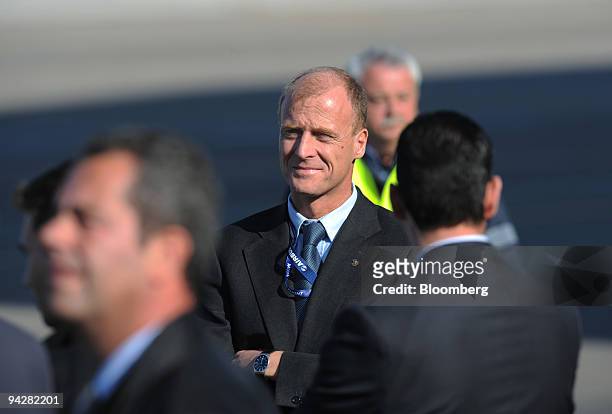 Tom Enders, chief executive officer of Airbus SAS, center, pauses before making a speech after the first flight of the Airbus SAS A400M at the Airbus...