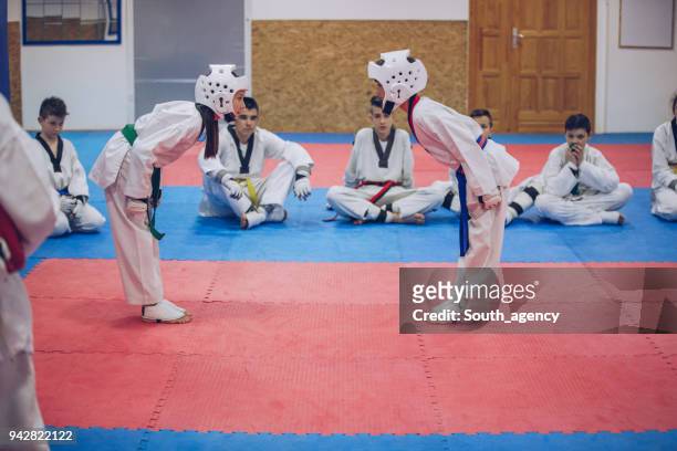 giving respect before the fight - karate belt stock pictures, royalty-free photos & images