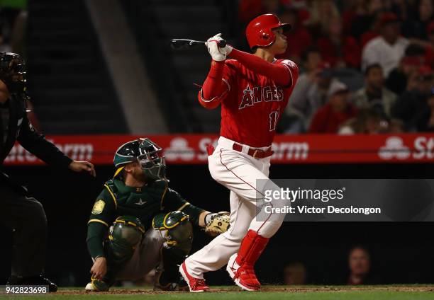 Shohei Ohtani of the Los Angeles Angels of Anaheim watches the ball go over the center field wall for a solo homerun during the second inning of the...