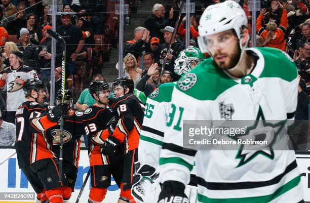 Hampus Lindholm, Jakob Silfverberg and Derek Grant of the Anaheim Ducks celebrate as Tyler Seguin of the Dallas Stars reacts to Grant's first-period...