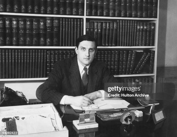 British journalist, and Assistant Editor of the Encyclopaedia Britannica, William Clarke at his desk, 1947.