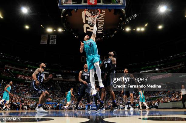 Willy Hernangomez of the Charlotte Hornets dunks the ball against the Orlando Magic on April 6, 2018 at Amway Center in Orlando, Florida. NOTE TO...