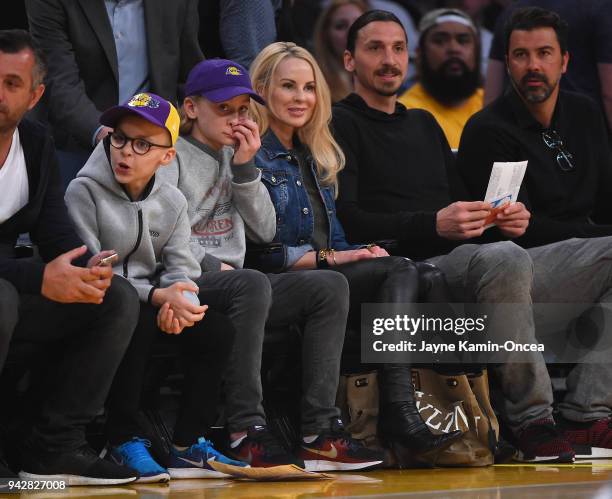 Zlatan Ibrahimovi of the Los Angeles Galaxy attends the game between the Los Angeles Lakers and the Minnesota Timberwolves with his wife Helena...