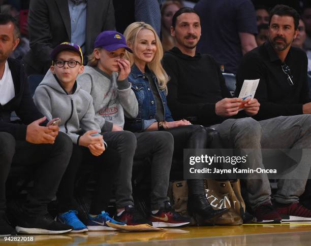 Zlatan Ibrahimovi of the Los Angeles Galaxy attends the game between the Los Angeles Lakers and the Minnesota Timberwolves with his wife Helena...