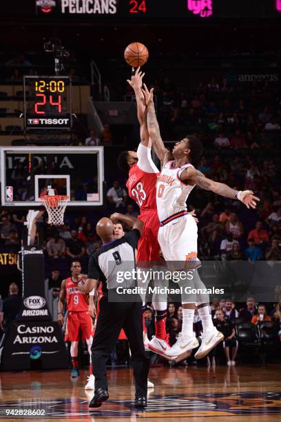 The opening tip off begins between Anthony Davis of the New Orleans Pelicans and Marquese Chriss of the Phoenix Suns on April 6, 2018 at Talking...