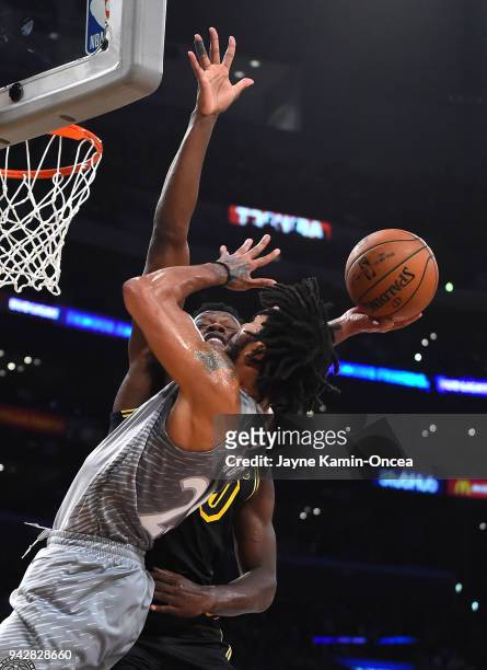 Julius Randle of the Los Angeles Lakers defends a shot by Derrick Rose of the Minnesota Timberwolves in the first half of the game at Staples Center...