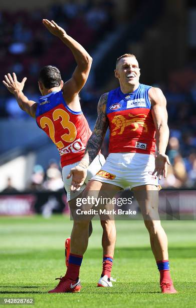 Charlie Cameron of the Lions celebrates his second goal with Mitch Robinson of the Lions during the round three AFL match between the Port Adelaide...