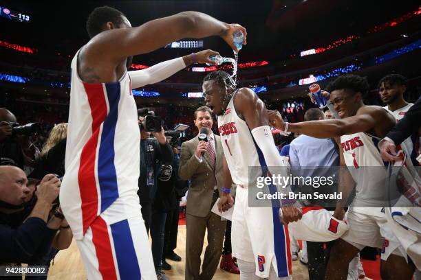 Andre Drummond celebrates with Reggie Jackson of the Detroit Pistons after the game against the Dallas Mavericks on April 6, 2018 at Little Caesars...