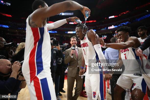 Andre Drummond celebrates with Reggie Jackson of the Detroit Pistons after the game against the Dallas Mavericks on April 6, 2018 at Little Caesars...