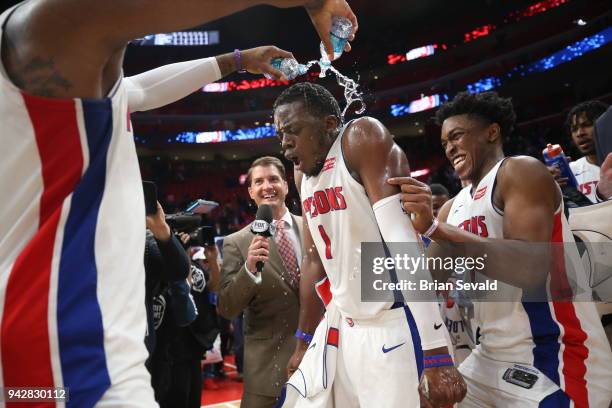 Andre Drummond celebrates with Reggie Jackson of the Detroit Pistons after the game against the Dallas Mavericks on April 6, 2018 at Little Caesars...