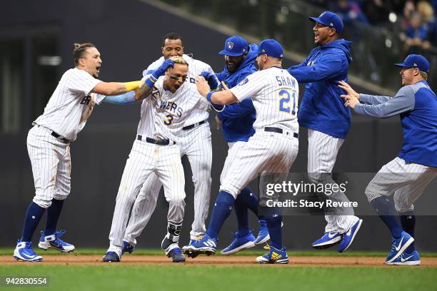 Orlando Arcia of the Milwaukee Brewers is congratulated by teammates after the game winning hit in the ninth inning against the Chicago Cubs at...